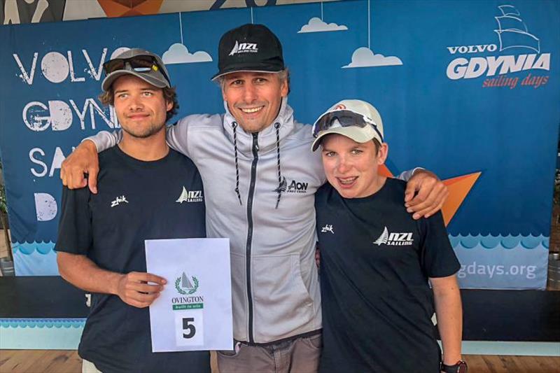 Pat Morgan, left, and Brayden Hamilton celebrate their fifth place with Yachting New Zealand head youth coach Matt Thomas photo copyright Yachting NZ taken at  and featuring the 29er class