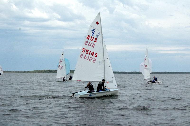 Sailing Azzurra (sail number 55149) and in second place for the female championship at the end of day two, Oliva Cameron and Lilly Fogarty, work hard to get their spinnaker up at the 2023 Australian 420 Championship photo copyright Jeanette Severs taken at Metung Yacht Club and featuring the 420 class