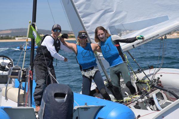 Dan Willcox and Paul Snow-Hansen celebrate with coach Geoff Woolley photo copyright Joao Costa Ferreira taken at Vilamoura Sailing and featuring the 470 class