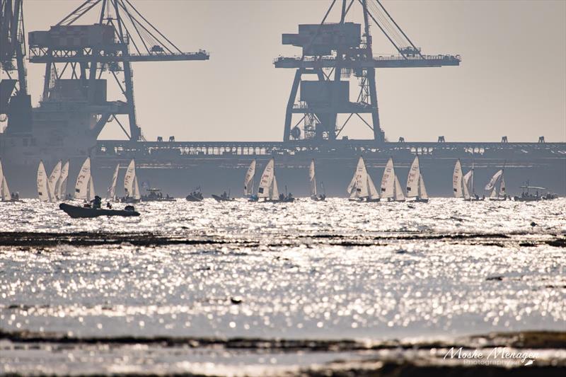 The cranes look on approvingly as 470s cross the finish on 470 Worlds at Sdot Yam, Israel day 5 - photo © Moshe Menagen / Int. 470 Class