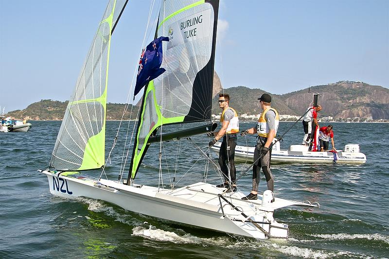 Peter Burling and Blair Tuke celebrate their Medal Race and Gold Medal win - Rio 2016 photo copyright Richard Gladwell taken at Iate Clube do Rio de Janeiro and featuring the 49er class