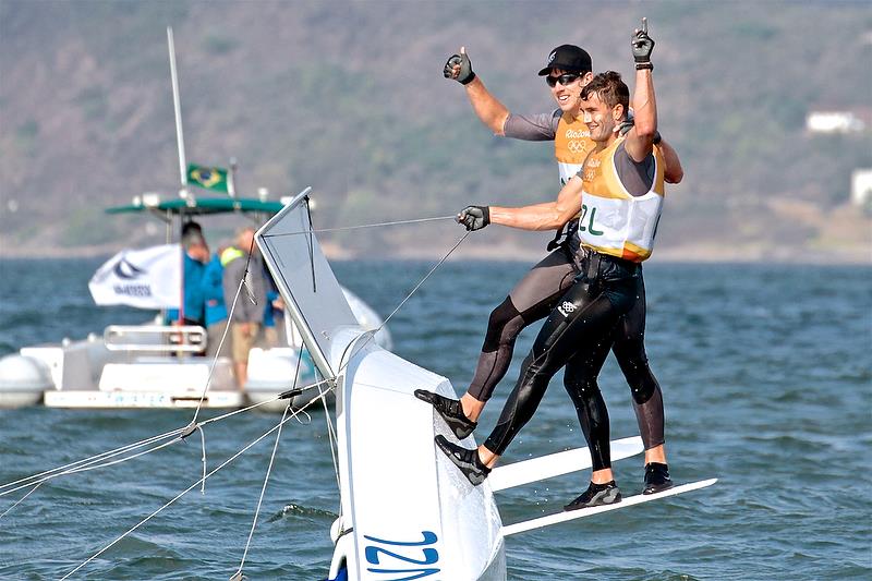 Peter Burling and Blair Tuke celebrate their Medal Race and Gold Medal win - Rio 2016 photo copyright Richard Gladwell taken at Iate Clube do Rio de Janeiro and featuring the 49er class