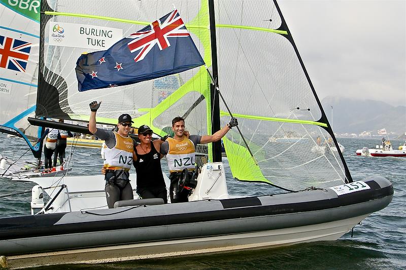 Peter Burling, Hamish Willcox (coach) and Blair Tuke celebrate their Gold Medal win in the 49er class, Rio Olympics, August 2016 - photo © Richard Gladwell