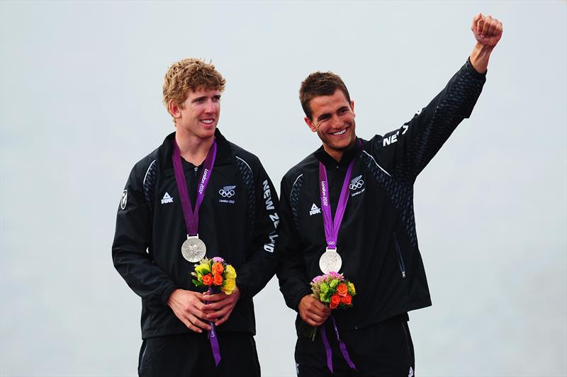 Peter Burling (L) and Blair Tuke (R)  celebrate winning silver in the Men's 49er Sailing, London 2012 Olympic Games at the Weymouth  - photo © Getty Images