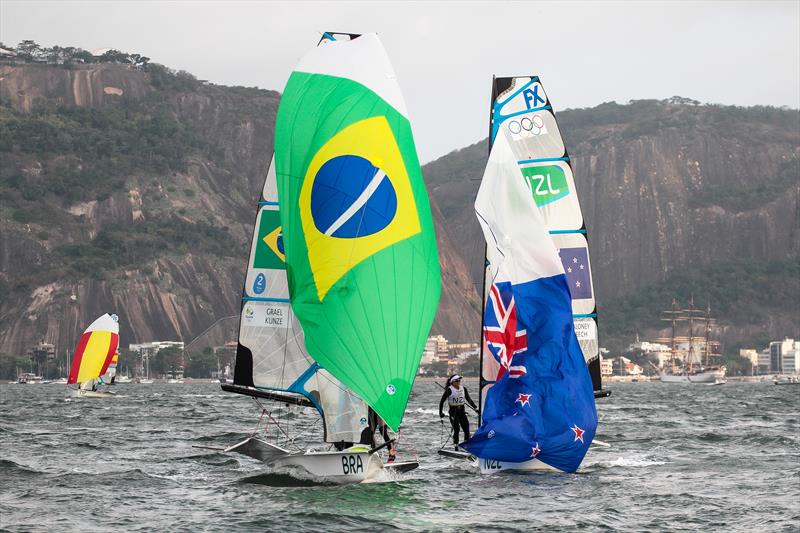Martine Grael and Kahena Kunze hold a narrow lead on the final metres to the finish line, with Molly Meech and Alex Maloney just behind - Medal Race - 49er FX - Rio 2016 - photo © Richard Gladwell 
