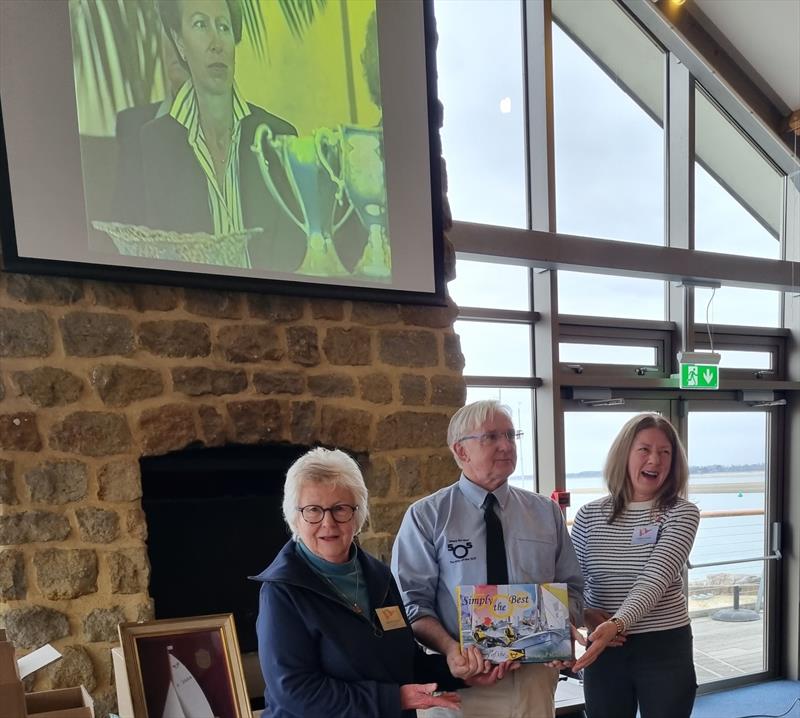 Belinda Cook (l) and Leonie Austin (r) accepting a copy on behalf of the host club, this will be a useful reference work in their archives. Above, the Princess Royal looks on, like her great great-great grandma, she is not amused! - photo © Sue Tulloch