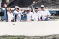 The crew of Momo II celebrate their 2025 Open Six Metre World Championship victory © SailingShots by Maria Muiña