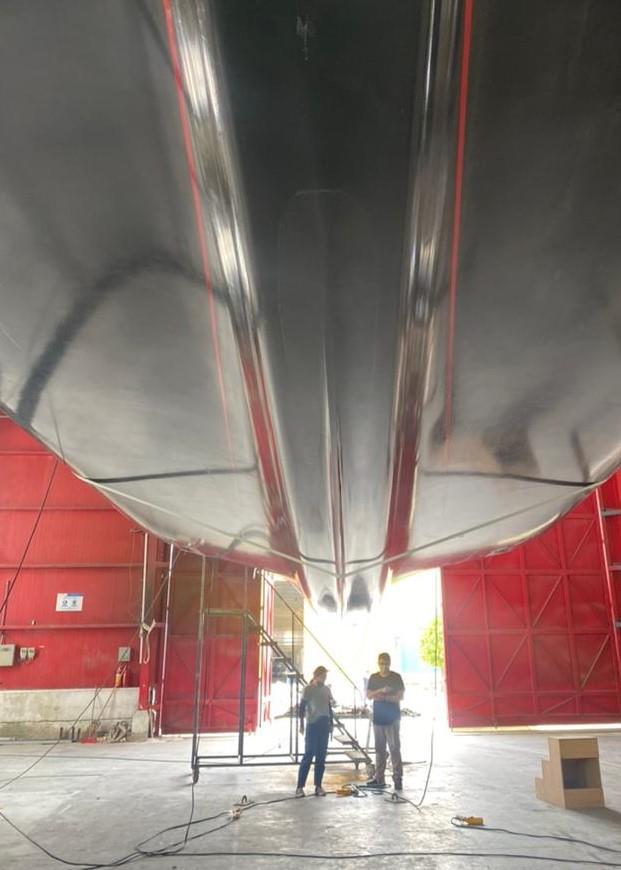 First AC40 is taken from the mould at McConaghy Boats, China - April 2022 - photo © Emirates Team New Zealand