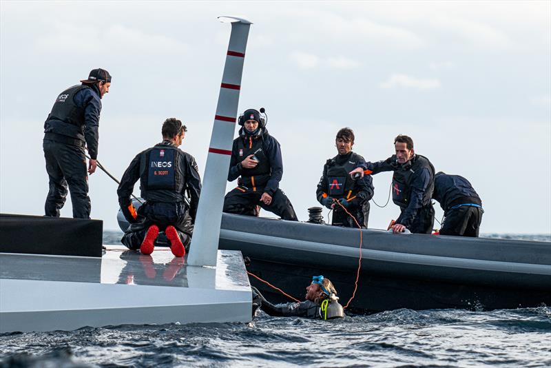 1614hrs: Diver in water to assist with righting - LEQ12 -  February 8, 2023 - Mallorca photo copyright Ugo Fonolla / America's Cup taken at Royal Yacht Squadron and featuring the AC40 class
