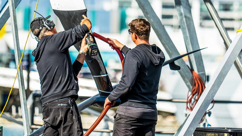 Working on the foil arm repair - Emirates Team New Zealand - AC40 - LEQ12 - Day 23, May 17, 2023 - photo © Adam Mustill/America's Cup