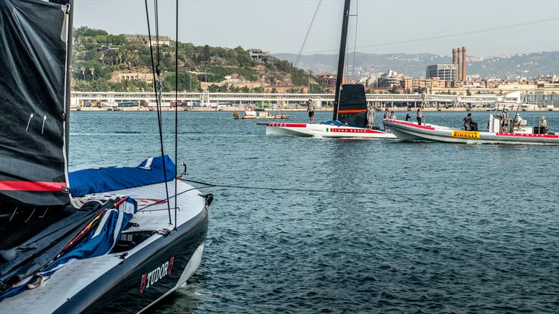  Luna Rossa tows past Alinghi Red Bull Racing - AC40 - Day 41 - July 12, 2023 - Barcelona - photo © Alex Carabi / America's Cup