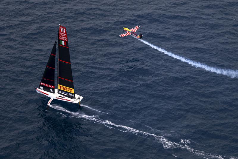 Dario Costa of Italy flies with the AC40s of Luna Rossa Prada Pirelli prior to the 37th Americs Cup Preliminary Regatta in Villanova photo copyright Jorg Mitter taken at Circolo della Vela Sicilia and featuring the AC40 class