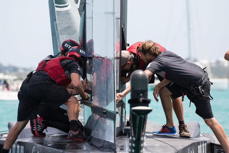 Land Rover BAR assess damage to their wing on the first day of the Louis Vuitton America's Cup Challenger Playoffs photo copyright Harry KH / Land Rover BAR taken at  and featuring the AC50 class