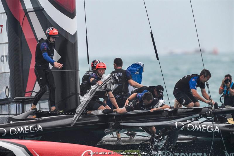 Emirates Team New Zealand capsize on the second day of the Louis Vuitton America's Cup Challenger Playoffs photo copyright ACEA 2017 / Ricardo Pinto taken at  and featuring the AC50 class