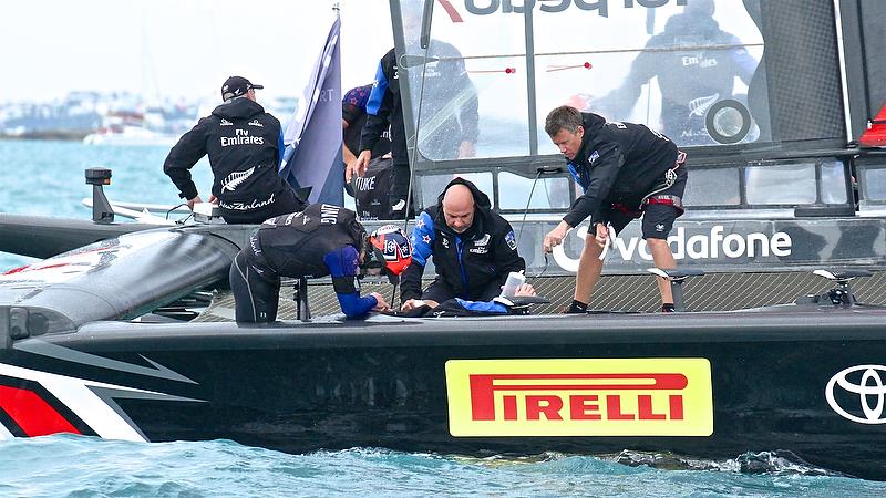 Peter Burling head down - Repairs after Race 4 - Finals, America's Cup Playoffs- Day 15, June 11, 2017 (ADT) photo copyright Richard Gladwell taken at  and featuring the AC50 class