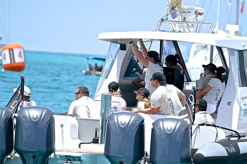 Oracle Team USA is followed intently from her tender - Larry Ellison is the most extreme left - America's Cup 35th Match - Match Day 5 - Regatta Day 21, June 26, 2017 (ADT) photo copyright Richard Gladwell taken at  and featuring the AC50 class