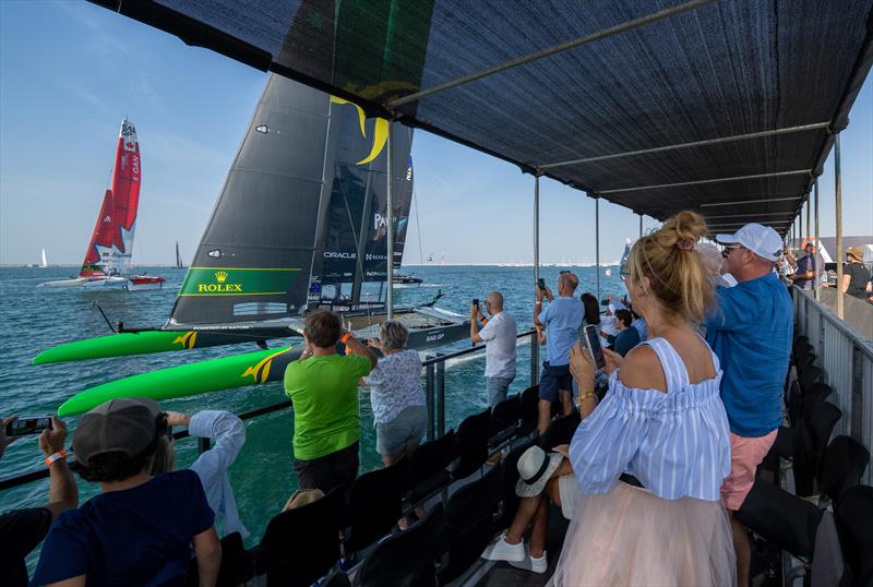 Spectators watch the Australia SailGP Team sail closely past the Waterfront Platinum Area on Race Day 1 of the Dubai Sail Grand Prix - November 12, 2022 - photo © Adam Warner/SailGP