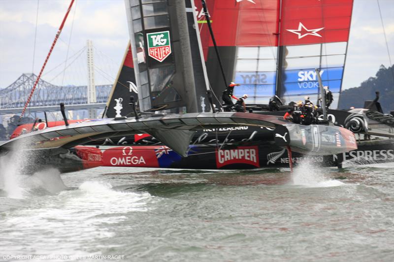 ORACLE TEAM USA narrowly miss Emirates Team New Zealand during race 13 of the 34th America's Cup photo copyright Gilles Martin-Raget / ACEA taken at  and featuring the AC72 class