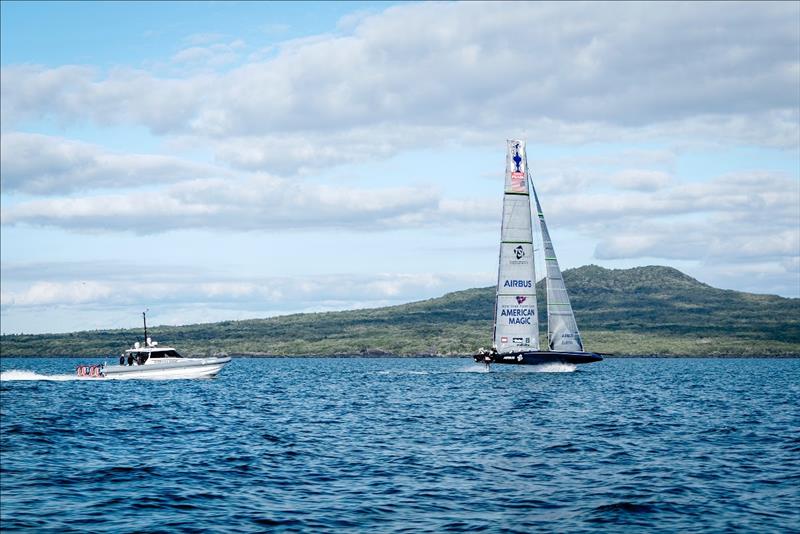 DEFIANT foils past Auckland's Rangitoto Island during her first sail at the venue of the upcoming America's Cup photo copyright American Magic / Ryan Pellett / ACE taken at  and featuring the AC75 class