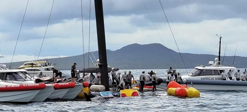 The America's Cup support teams work together to save NYYC American Magic's Patriot after a huge capsize on day 3 of the PRADA Cup photo copyright Richard Gladwell / Sail-World.com taken at  and featuring the AC75 class