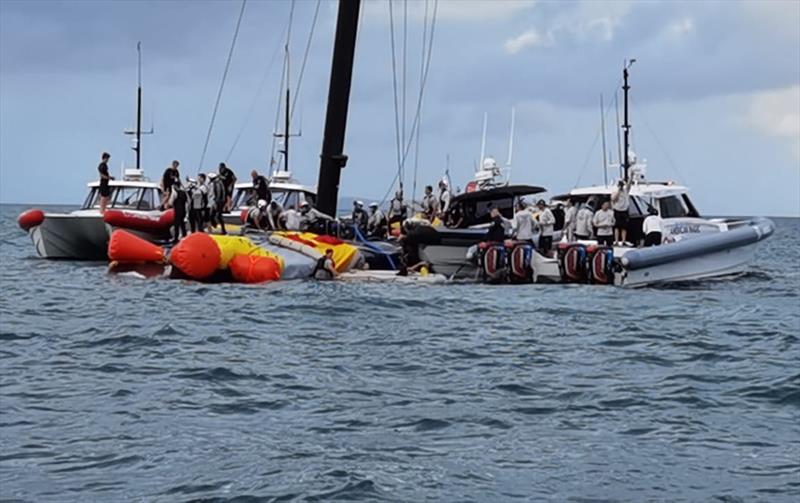 The America's Cup support teams work together to save NYYC American Magic's Patriot after a huge capsize on day 3 of the PRADA Cup - photo © Richard Gladwell / Sail-World.com