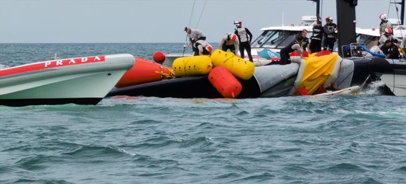 The America's Cup support teams work together to save NYYC American Magic's Patriot after a huge capsize on day 3 of the PRADA Cup - photo © Richard Gladwell / Sail-World.com