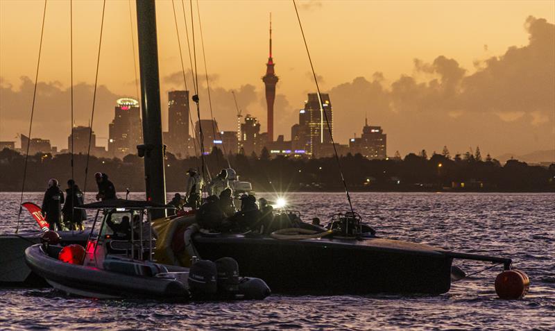 Still working to bring Patriot home at sunset photo copyright COR36 / Studio Borlenghi taken at  and featuring the AC75 class