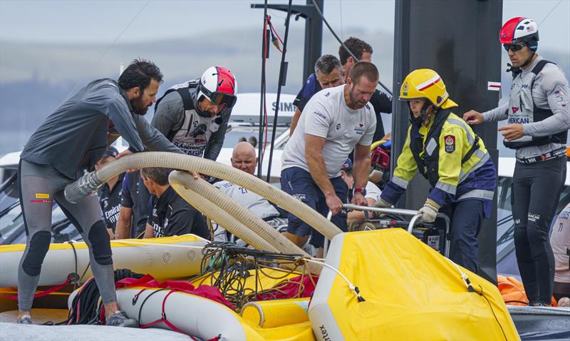 Teams and rescue services working together to save Patriot photo copyright COR36 / Studio Borlenghi taken at  and featuring the AC75 class