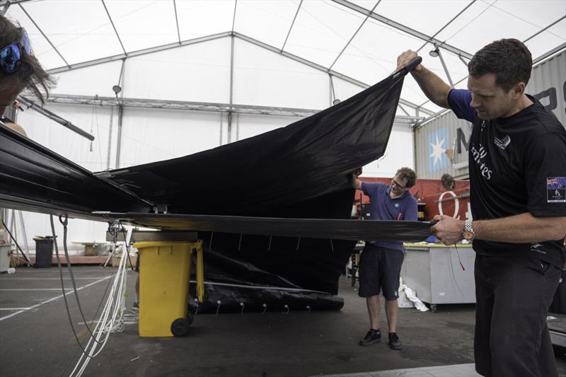 Designers check the double skin mainsail for the prototype - Emirates Team New Zealand testing a soft wing concept sail in Auckland, New Zealand, February 2018 photo copyright Hamish Hooper taken at Royal New Zealand Yacht Squadron and featuring the AC75 class