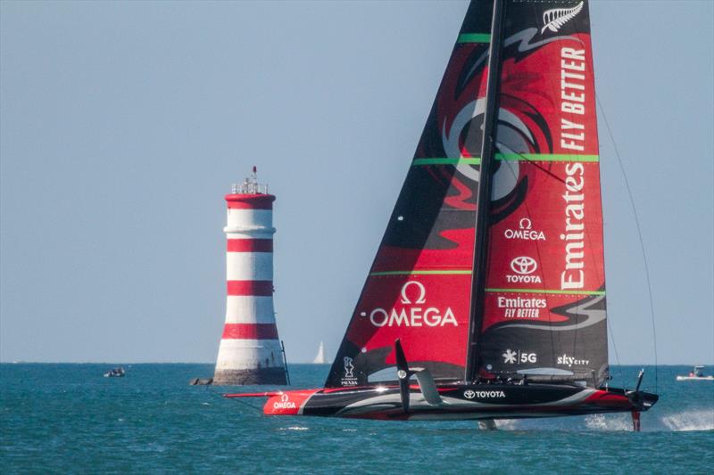 Emirates Team New Zealand passes Rangitoto Lighthouse - Waitemata Harbour - October 12, 2019 photo copyright Richard Gladwell taken at Royal New Zealand Yacht Squadron and featuring the AC75 class
