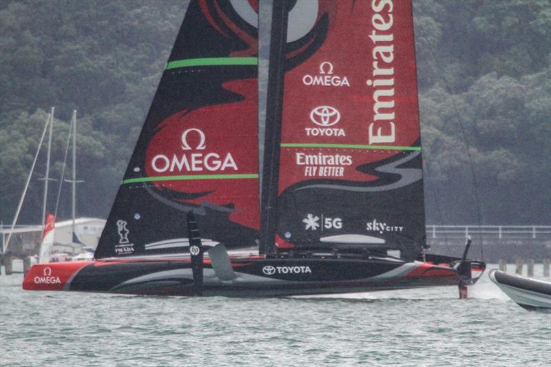 6. Spy boat drops back revealing Te Aihe's stern sections well clear, with bow lifting and now only the centre of the hull and bustle in contact with the water  - Phases of Foiling - December 2019 - photo © Richard Gladwell / Sail-World.com