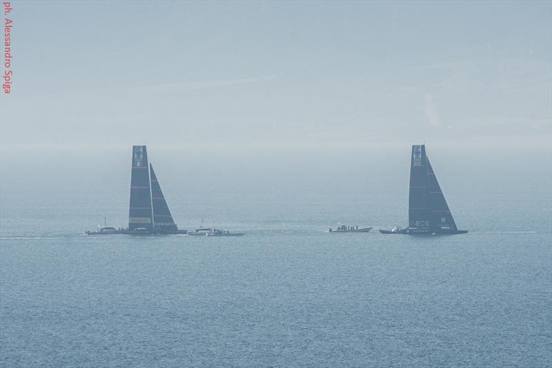 INEOS Team UK head out as Luna Rossa comes back into port and begins dropping her jib - Cagliari, Sardinia - January 20120 photo copyright Alessandro Spiga taken at Circolo della Vela Sicilia and featuring the AC75 class