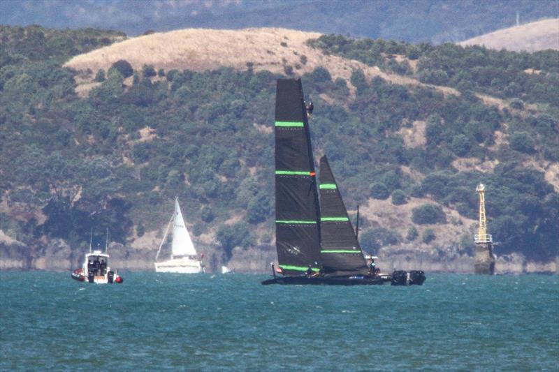 A man up the mast  - Te Kahu - Emirates Team NZ's test boat - Waitemata Harbour - February 11, 2020 photo copyright Richard Gladwell / Sail-World.com taken at Royal New Zealand Yacht Squadron and featuring the AC75 class