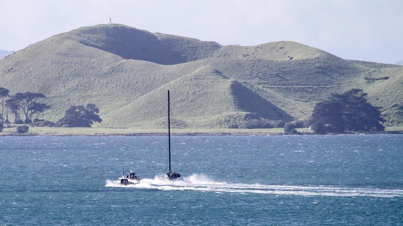 American Magic - under tow - heads for Tamaki Strait with Browns Island in the background - Auckland - August 7, 2020 - 36th America's Cup photo copyright Richard Gladwell / Sail-World.com taken at New York Yacht Club and featuring the AC75 class