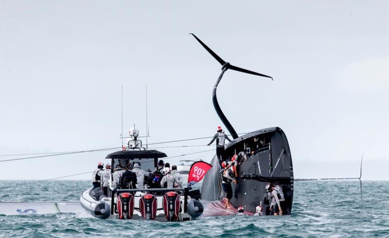 All sailors are deemed safe following the capsize, and begin work to start righting the AC75 photo copyright Sailing Energy / American Magic taken at  and featuring the AC75 class