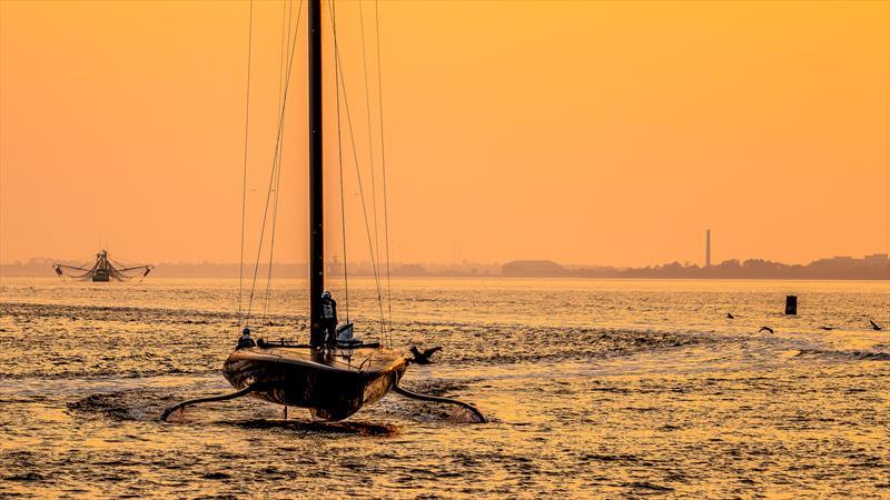 Patriot on tow in the sunset -  AC75 - December 9, 2022 - Pensacola, Fl photo copyright Paul Todd/America's Cup taken at New York Yacht Club and featuring the AC75 class