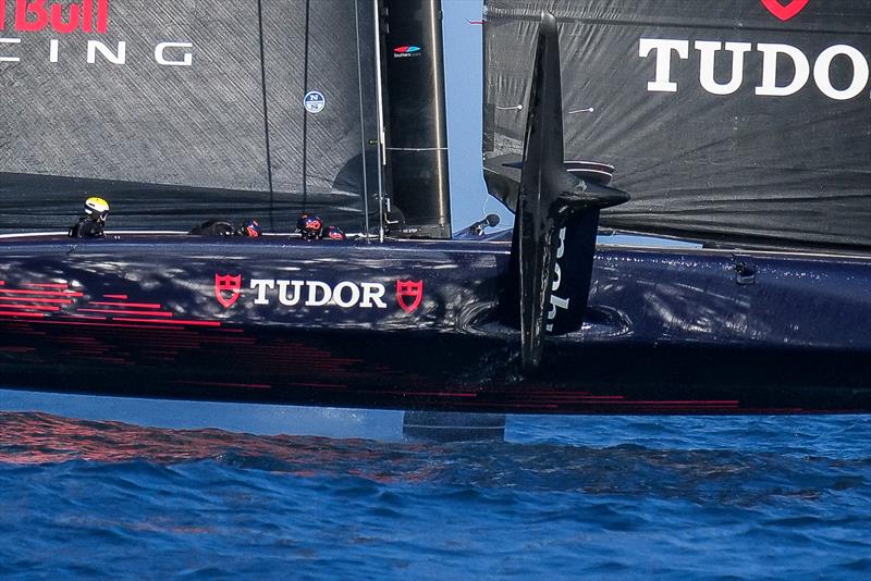 Two of the crew are in the inside row of pits, with heads down and cycling - AC75 - Alinghi Red Bull Racing - March 4, 2023 - Barcelona - Day 47 - photo © Alex Carabi / America's Cup