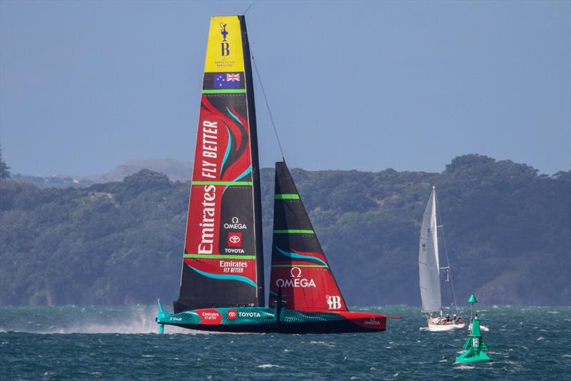 Emirates Team New Zealand passes ahead of NZ's first major international trophy winner - Rainbow II - winner of the One Ton Cup in 1969  - Waitemata Harbour - April 3, 2023 photo copyright Richard Gladwell / Sail-World.com/nz taken at Royal New Zealand Yacht Squadron and featuring the AC75 class