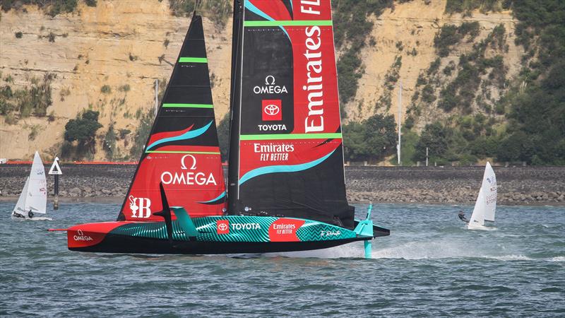 Emirates Team New Zealand's AC75 passes through a 420 training session on the Waitemata Harbour - April 20, 2023 photo copyright Richard Gladwell - Sail-World.com/nz taken at Royal New Zealand Yacht Squadron and featuring the AC75 class