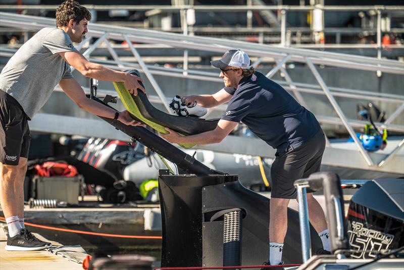 Putting the cyclor's couch on board - American Magic - AC75 - Day 3 - May 10, 2024 - Barcelona - photo © Alex Carabi / America's Cup