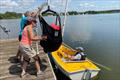 Hoist process step 3 - the wheelchair can be backed away, and the hoist rotates to move the sailor over the boat moored alongside © Magnus Smith