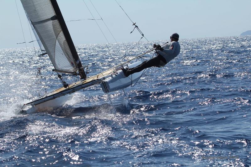 Even an older straight board A Class Cat is superb fun to sail on day 1 of the A Class Cat Worlds at Punta Ala photo copyright Gordon Upton taken at Centro Velico Punta Ala and featuring the A Class Catamaran class