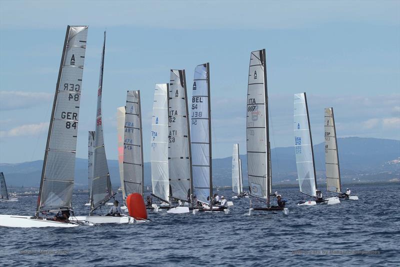 Action at the bottom mark on day 2 of the A Class Cat Worlds at Punta Ala photo copyright Gordon Upton taken at Centro Velico Punta Ala and featuring the A Class Catamaran class