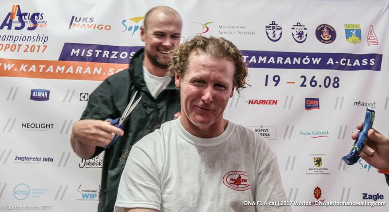 The traditional post-race haircut for Stevie from Steve Brayshaw in the A Class Cat Worlds at Sopot, Poland photo copyright Gordon Upton taken at Sopot Sailing Club and featuring the A Class Catamaran class
