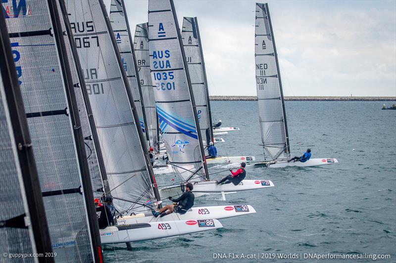 Race 7 in the Open fleet gets away cleanly on day 4 of the A Class Cat Worlds at the WPNSA photo copyright Gordon Upton / www.guppypix.com taken at Weymouth & Portland Sailing Academy and featuring the A Class Catamaran class