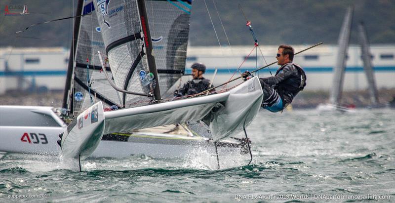 Rafa Gomez ESP finishing after a near miss on the line on day 4 of the A Class Cat Worlds at the WPNSA photo copyright Gordon Upton / www.guppypix.com taken at Weymouth & Portland Sailing Academy and featuring the A Class Catamaran class