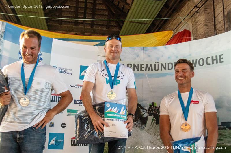 Manuel Calavia ESP (second and European Champion), Glenn Ashby AUS (Regatta Champion), Marciej Zarnowski (third place Foiling Division) at the A Class Catamaran European Championships in Warnemunde - photo © Gordon Upton / www.guppypix.com