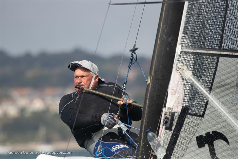 Scottish ex-pat, Micky Todd, sailing for Spain, may well be on the Classic Division podium on his current form photo copyright Gordon Upton / www.guppypix.com taken at Houston Yacht Club and featuring the A Class Catamaran class