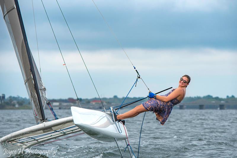 US Olympic development program team member, Cam Farrah, celebrating her High School graduation! She usually wears a little more in the way of impact protection and floatation kit photo copyright Joyce H Photography taken at Houston Yacht Club and featuring the A Class Catamaran class