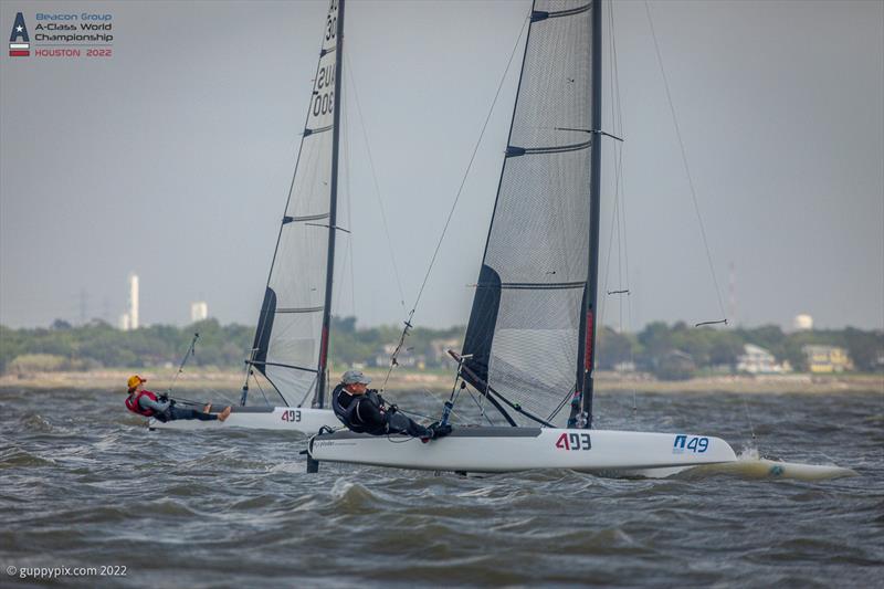 Landy and Son race uphill on day 3 of the Beacon Group A-Class Catamaran World Championships in Texas photo copyright Gordon Upton / www.guppypix.com taken at Houston Yacht Club and featuring the A Class Catamaran class